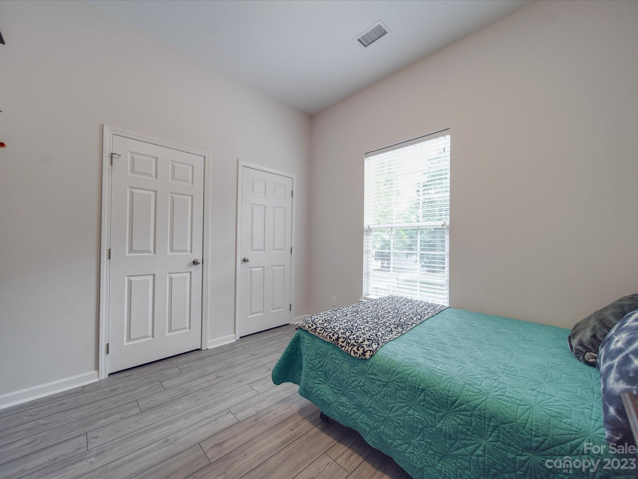 10102 Trailmoor Road Charlotte, NC 28278 - Photo 12 of 44 a bedroom with a bed and a window