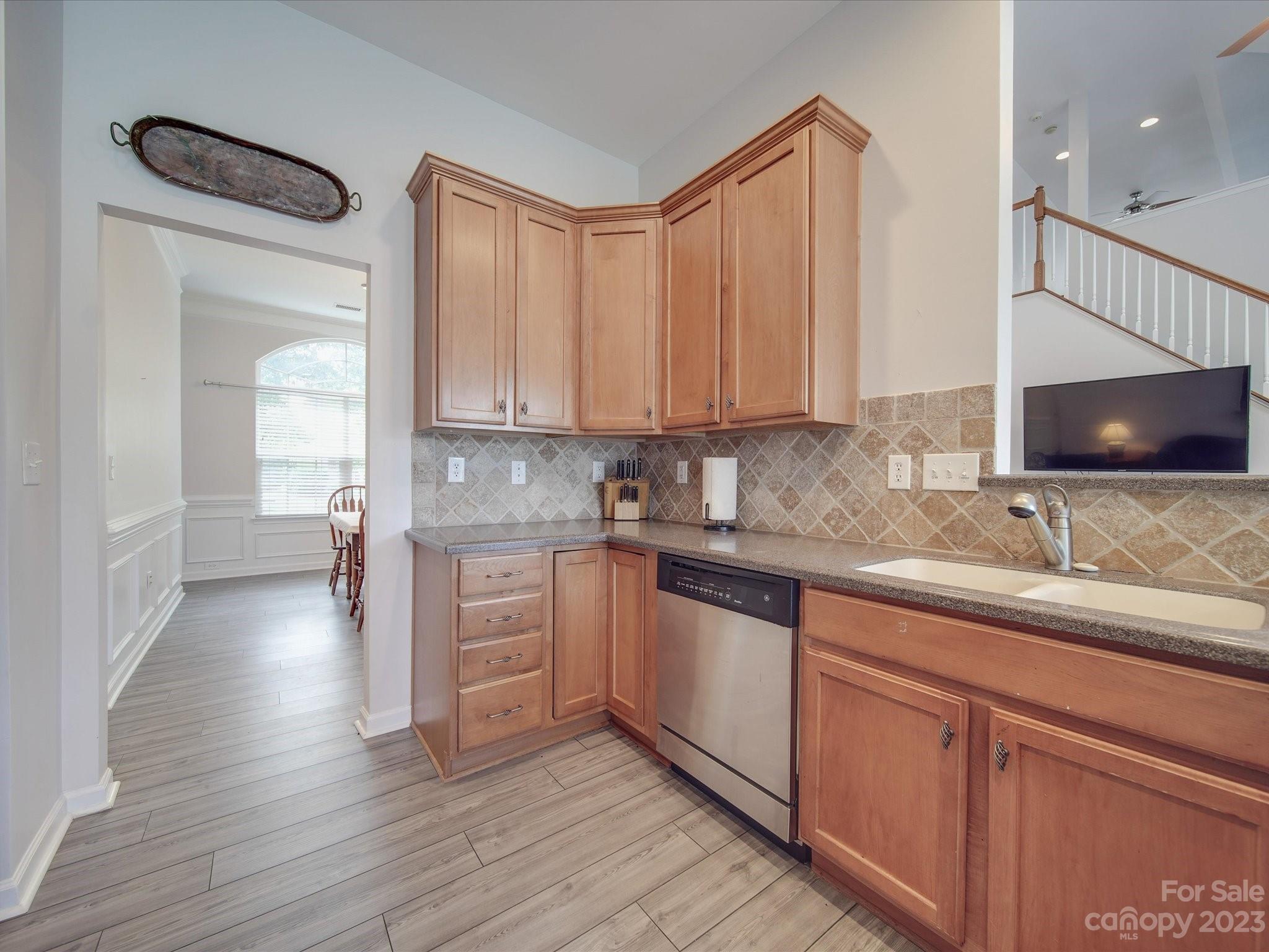 10102 Trailmoor Road Charlotte, NC 28278 - Photo 15 of 44 a kitchen with granite countertop a sink and cabinets