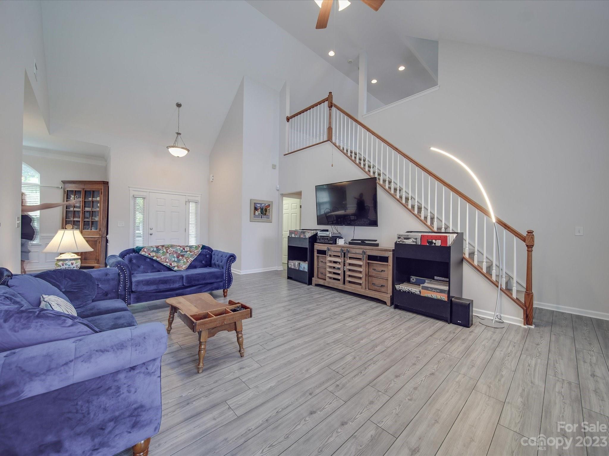 10102 Trailmoor Road Charlotte, NC 28278 - Photo 20 of 44 a living room with furniture and a flat screen tv