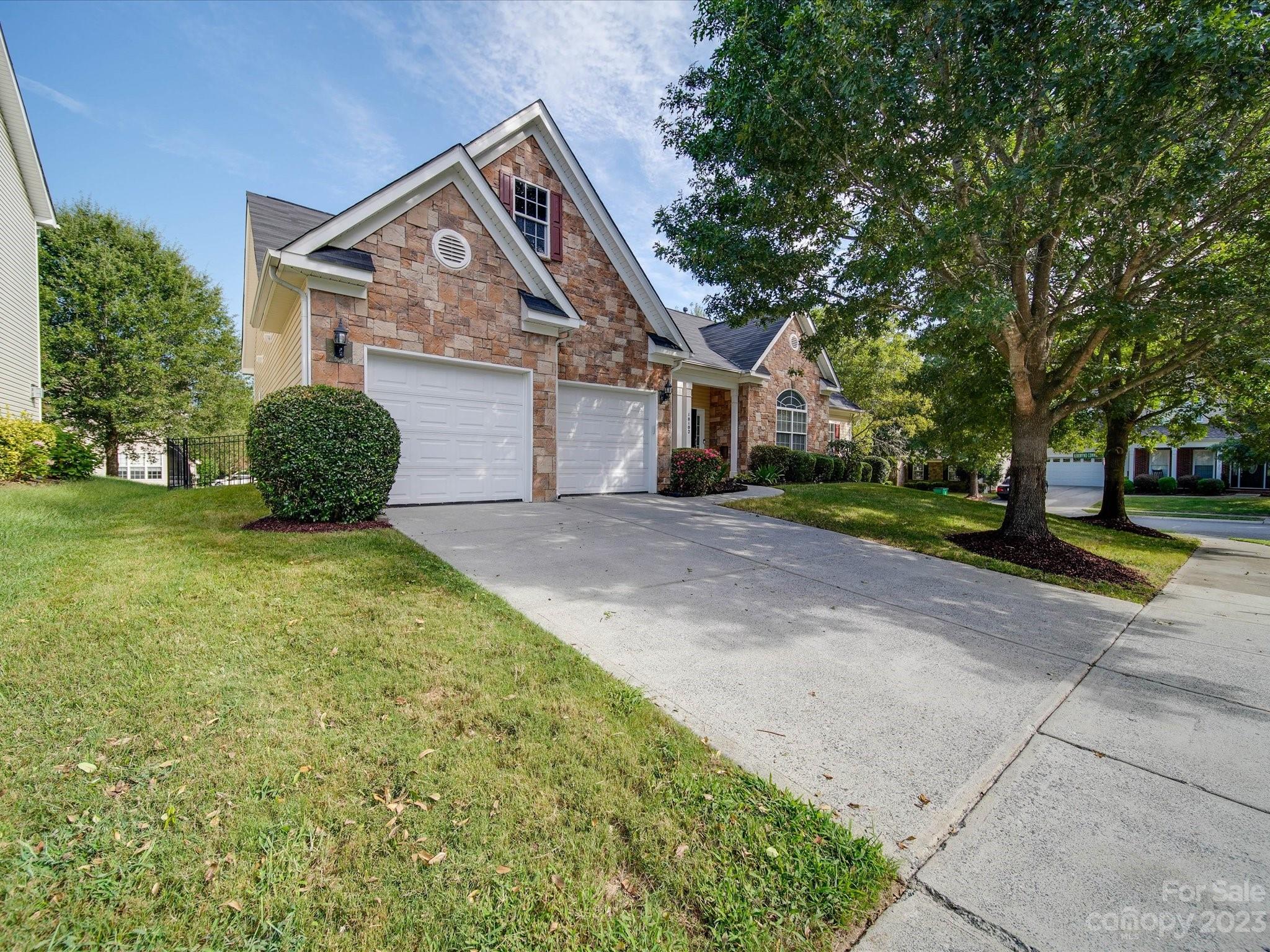 10102 Trailmoor Road Charlotte, NC 28278 - Photo 2 of 44 a front view of a house with a yard