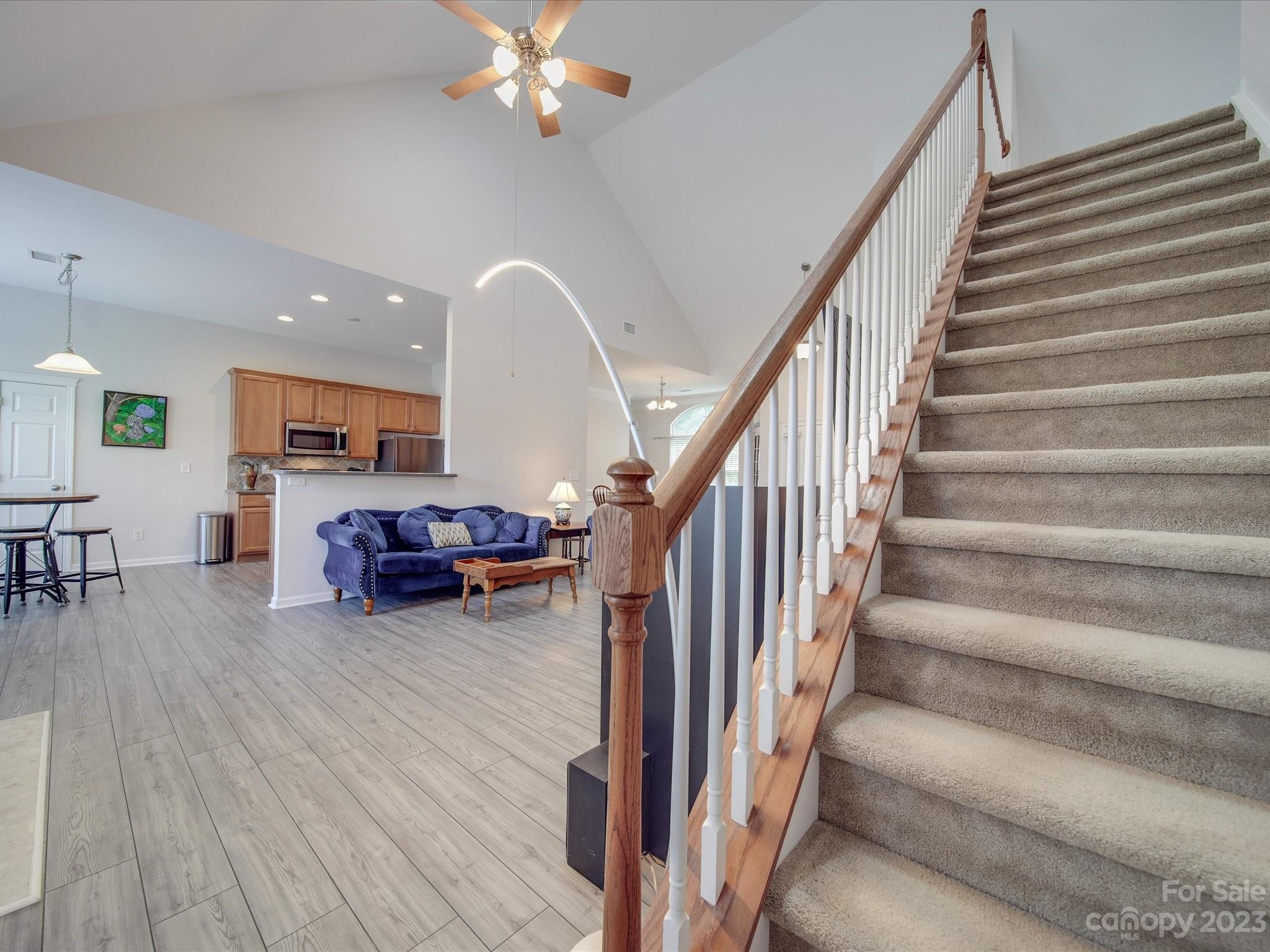 10102 Trailmoor Road Charlotte, NC 28278 - Photo 21 of 44 a view of a livingroom with furniture stairs and a livingroom with furniture