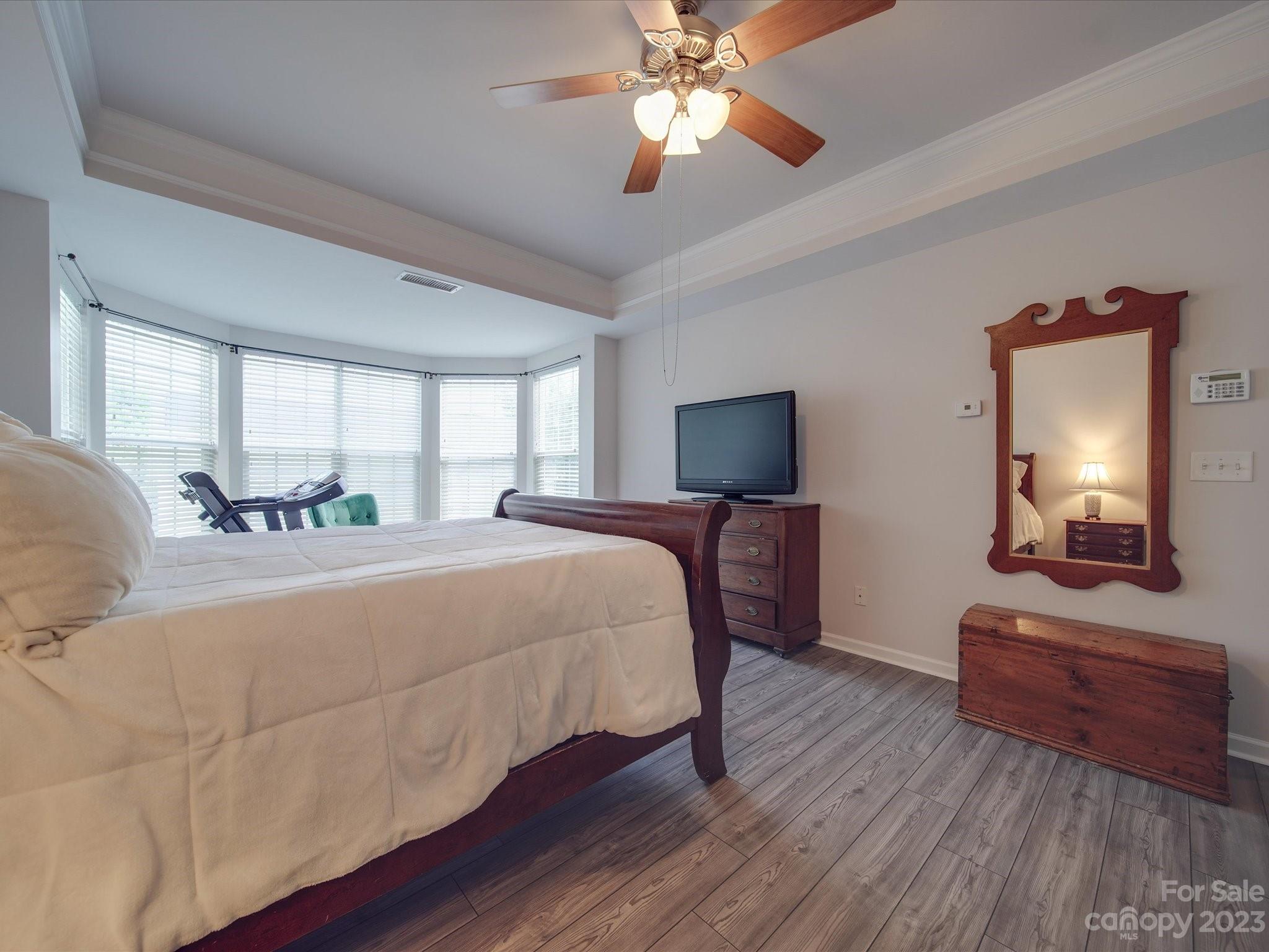 10102 Trailmoor Road Charlotte, NC 28278 - Photo 27 of 44 a bedroom with a bed and a mirror on dresser