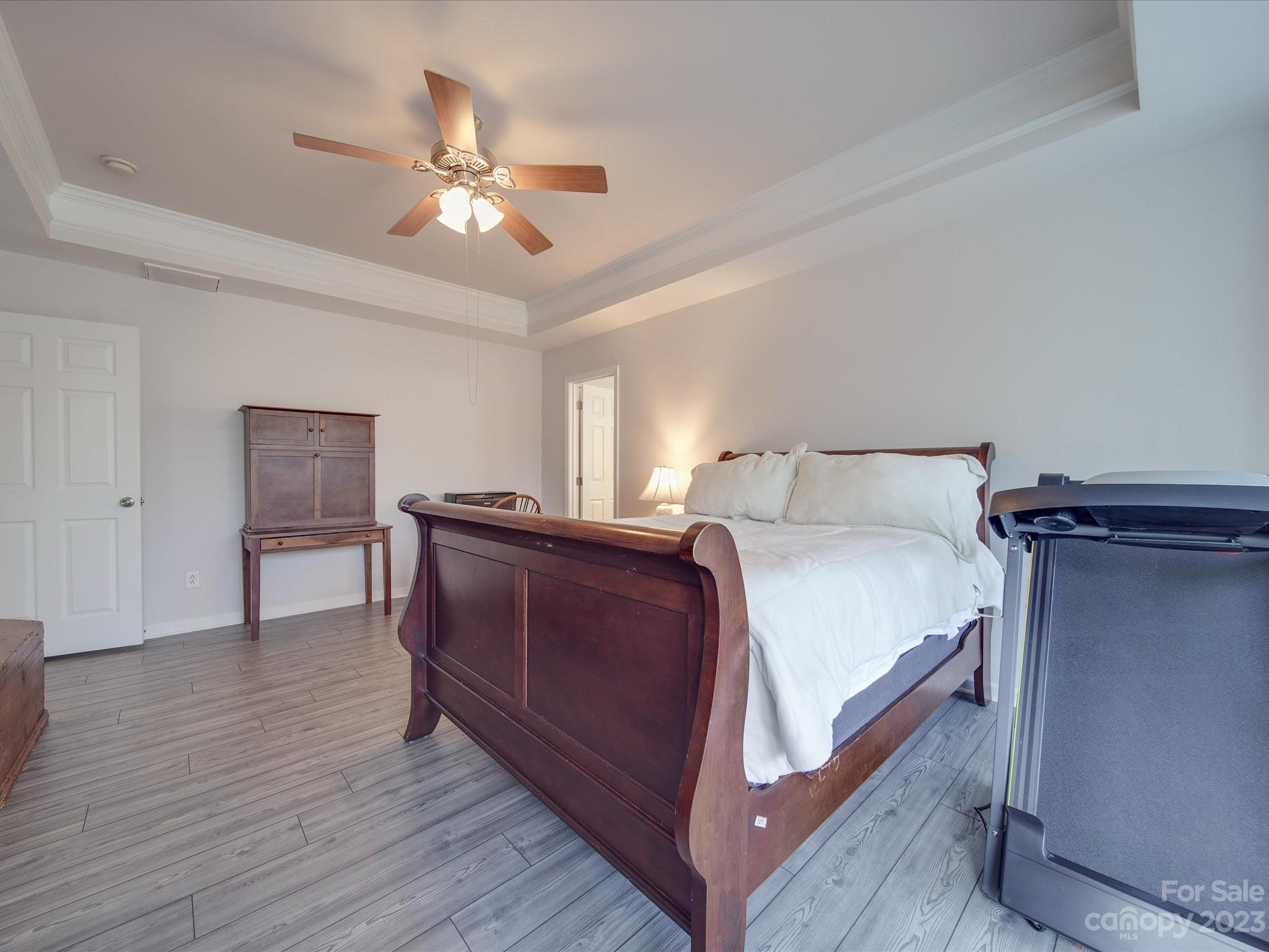 10102 Trailmoor Road Charlotte, NC 28278 - Photo 29 of 44 a bedroom with a bed and ceiling fan