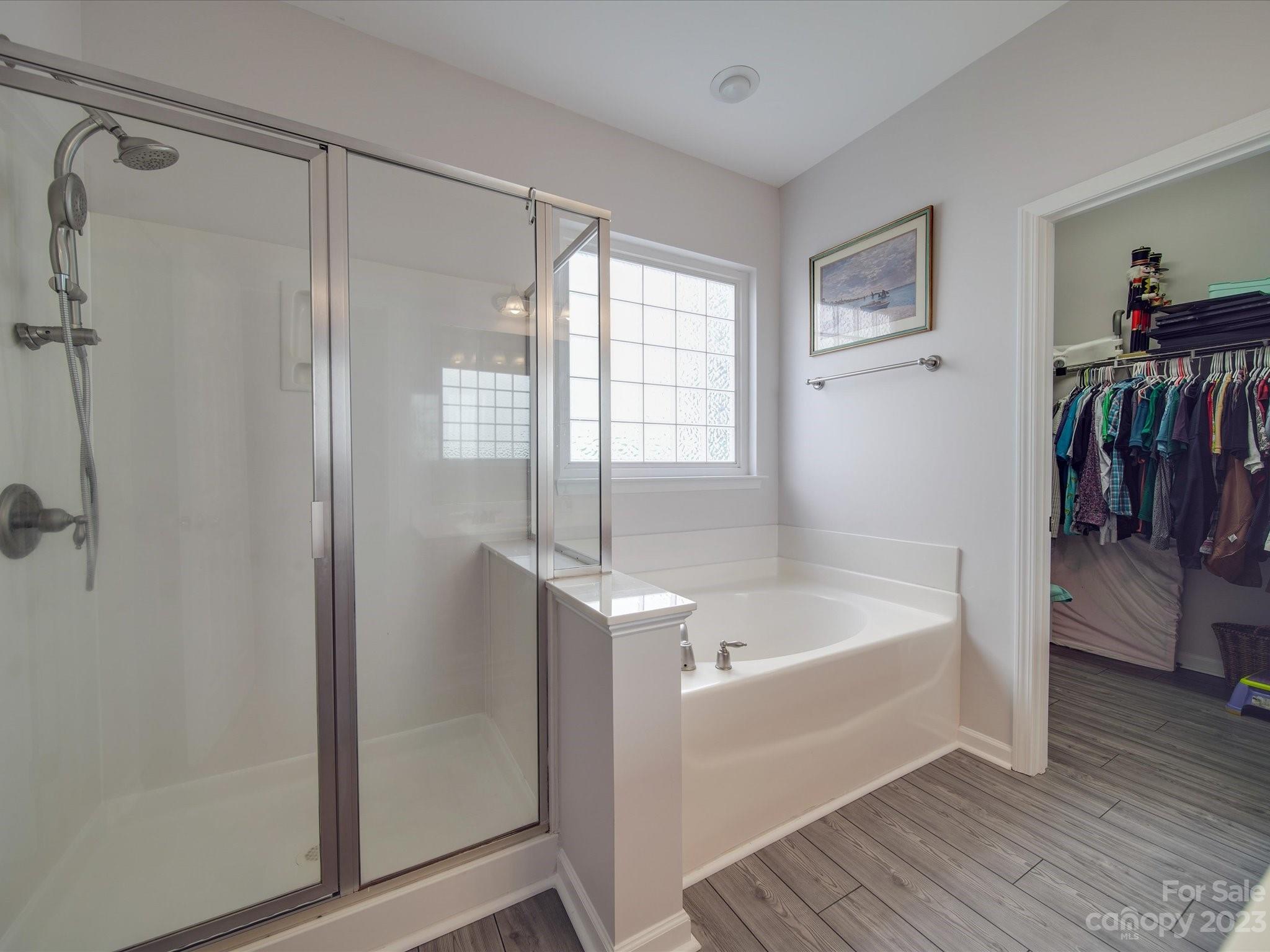 10102 Trailmoor Road Charlotte, NC 28278 - Photo 31 of 44 a bathroom with a tub shower and sink