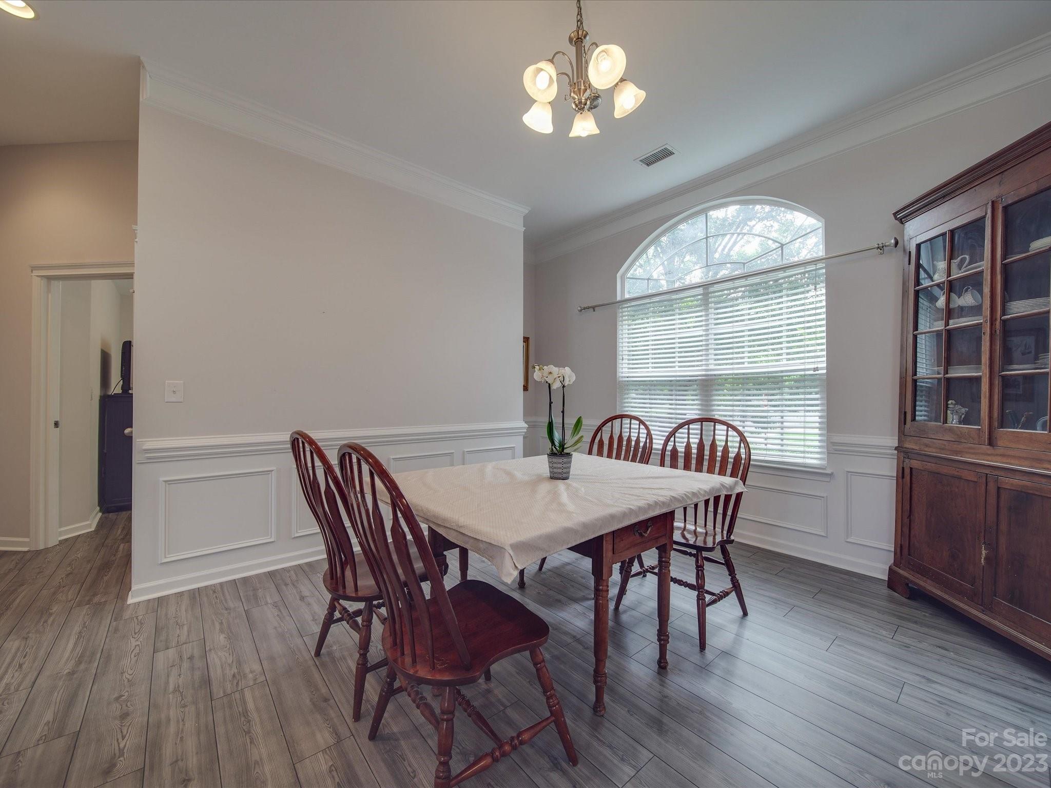 10102 Trailmoor Road Charlotte, NC 28278 - Photo 5 of 44 a view of a dining room with furniture window and wooden floor