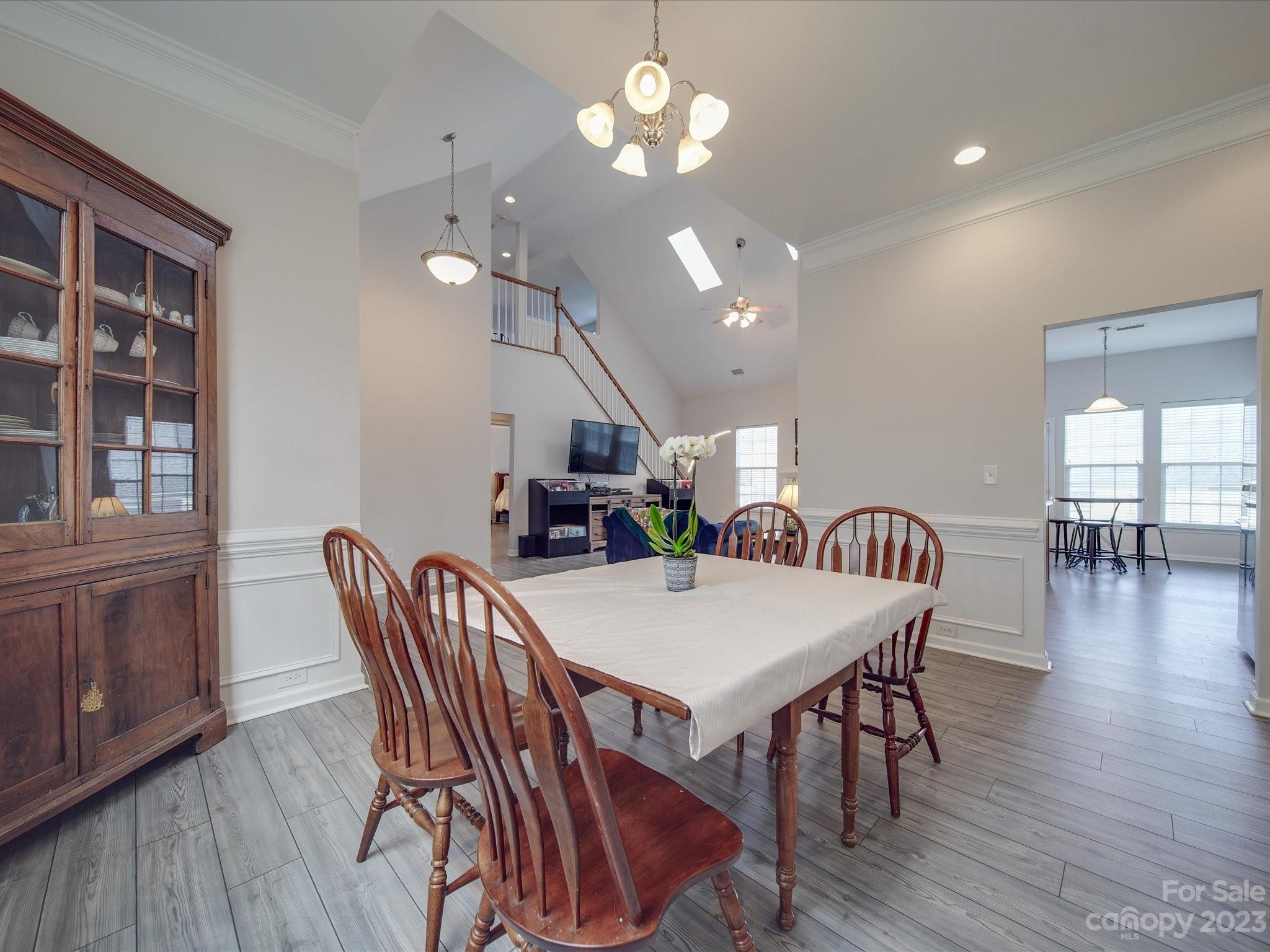 10102 Trailmoor Road Charlotte, NC 28278 - Photo 6 of 44 a view of a dining room with furniture window and wooden floor