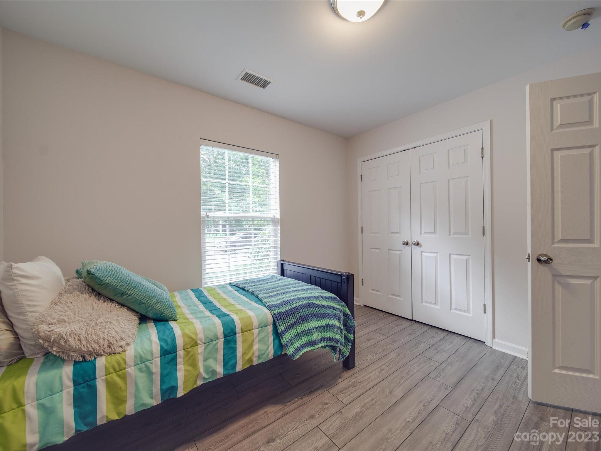 10102 Trailmoor Road Charlotte, NC 28278 - Photo 9 of 44 a bedroom with two beds and a window
