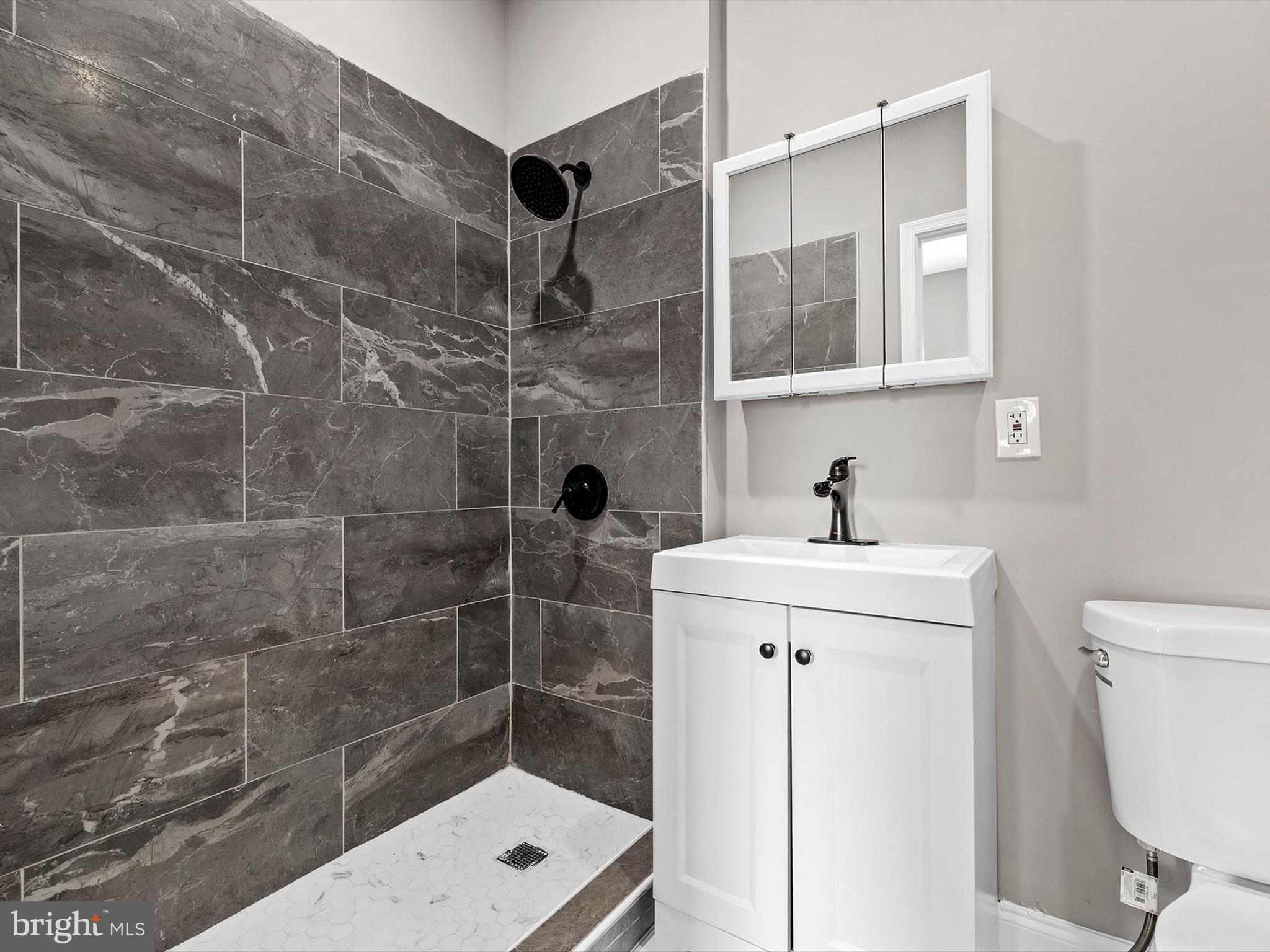 3032 Chelsea Terrace Baltimore, MD 21216 - Photo 16 of 29 a bathroom with a shower sink and toilet