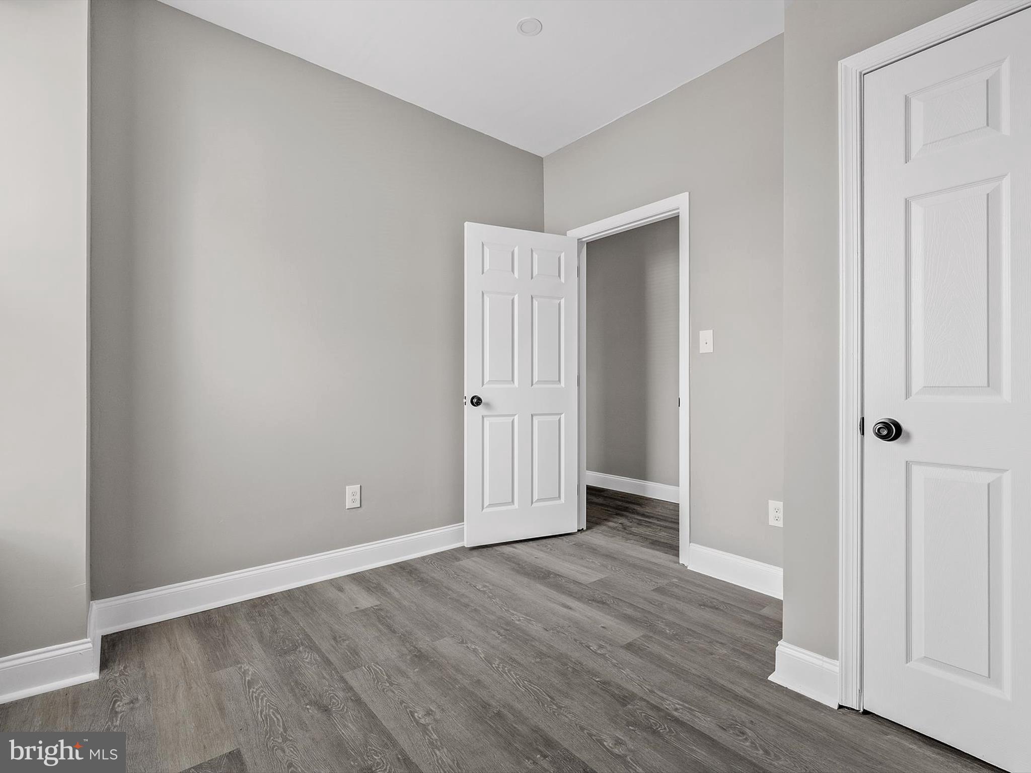 3032 Chelsea Terrace Baltimore, MD 21216 - Photo 18 of 29 a view of an empty room with wooden floor