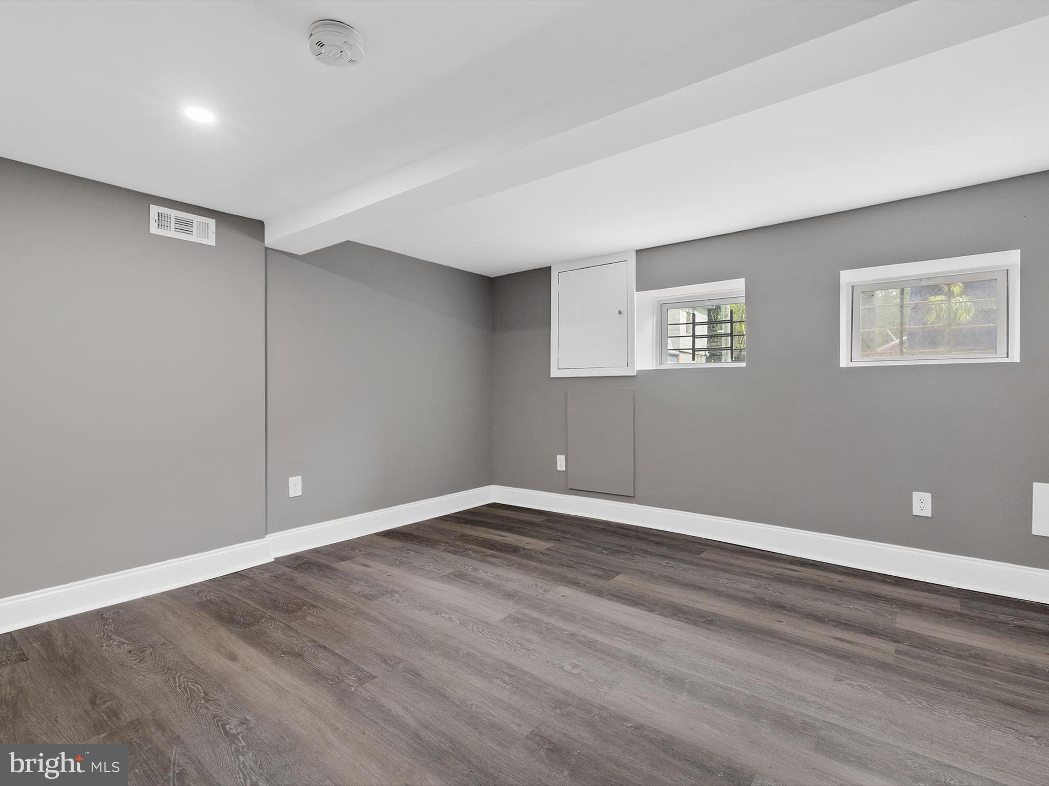 3032 Chelsea Terrace Baltimore, MD 21216 - Photo 23 of 29 a view of an empty room with wooden floor