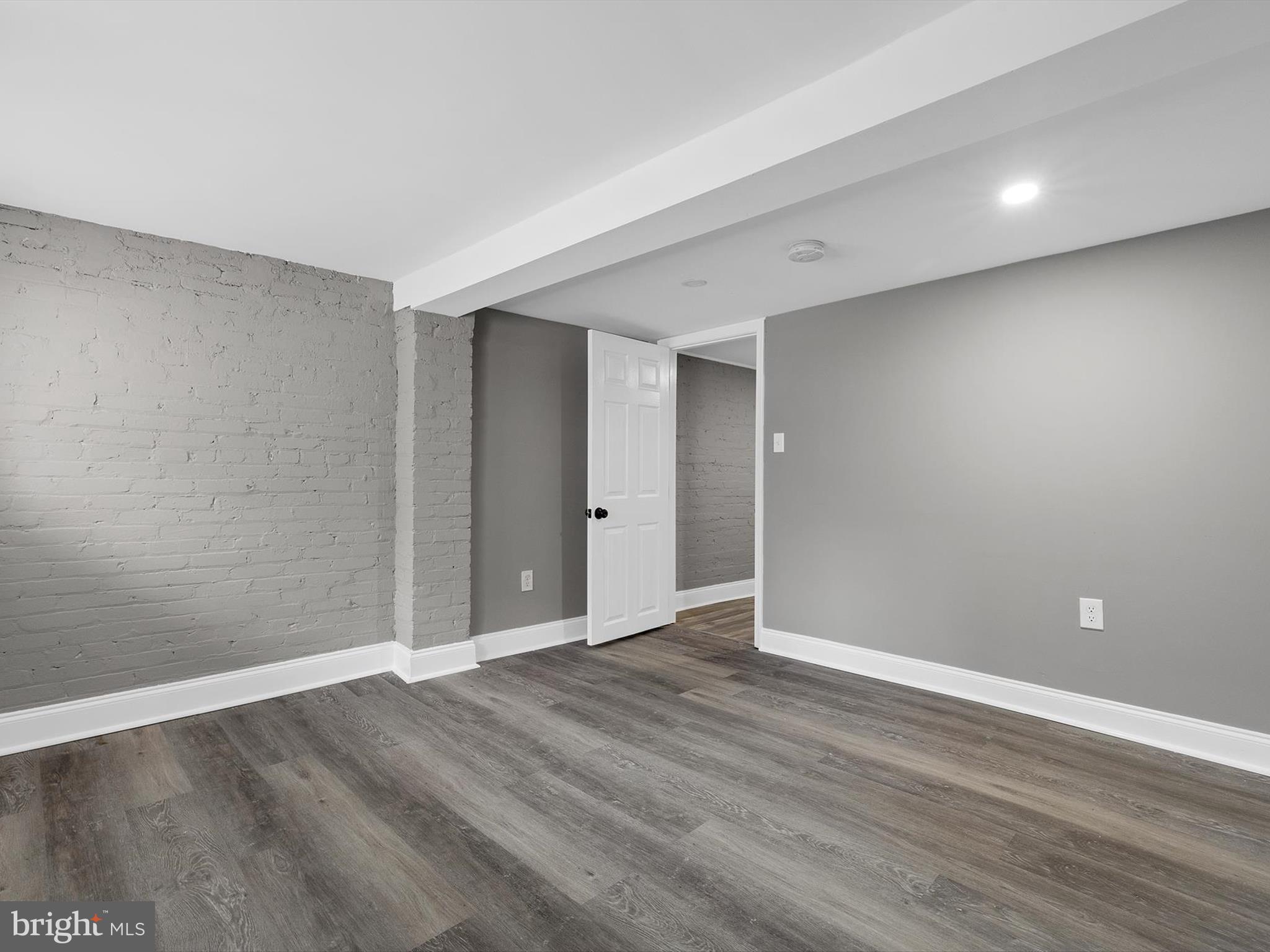 3032 Chelsea Terrace Baltimore, MD 21216 - Photo 24 of 29 a view of an empty room with wooden floor