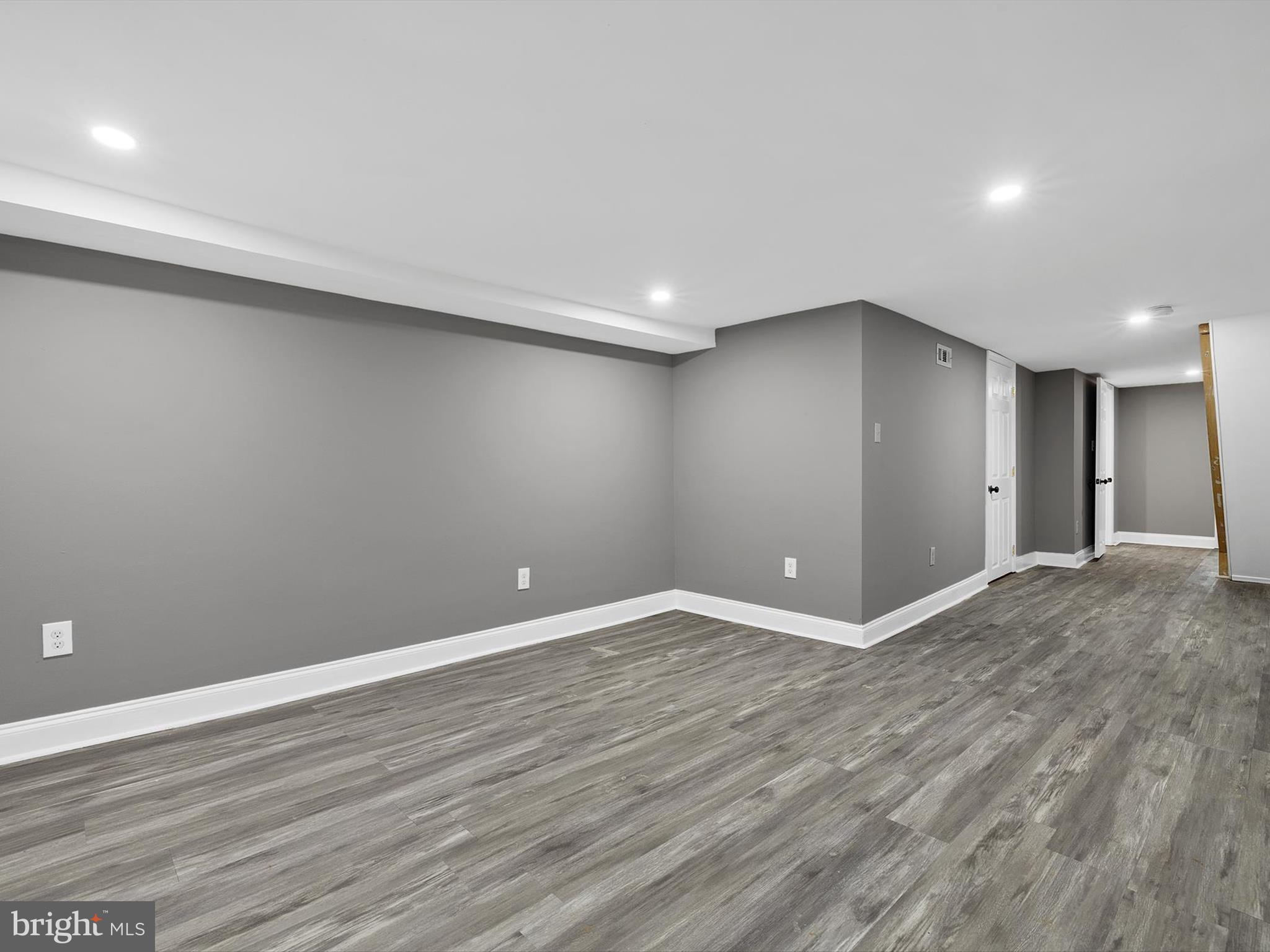 3032 Chelsea Terrace Baltimore, MD 21216 - Photo 26 of 29 a view of an empty room with wooden floor