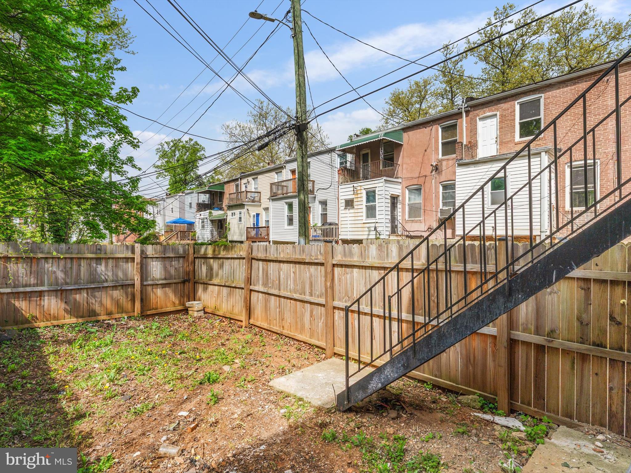 3032 Chelsea Terrace Baltimore, MD 21216 - Photo 29 of 29 a view of a house with wooden fence