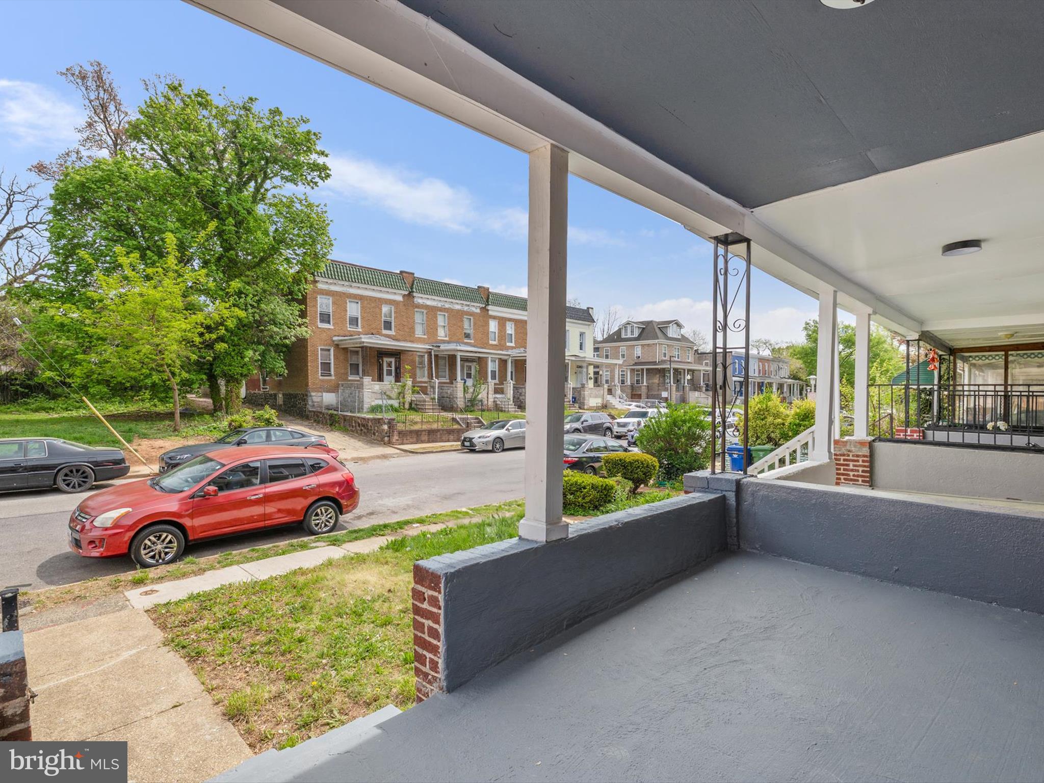 3032 Chelsea Terrace Baltimore, MD 21216 - Photo 3 of 29 a front view of a house with a yard