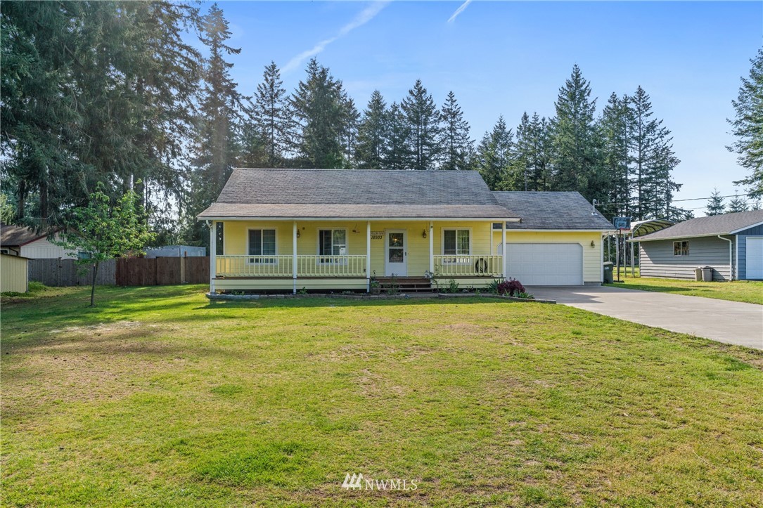 18933 Nutmeg Street Southwest Rochester, WA 98579 - Photo 1 of 18 a front view of a house with a swimming pool