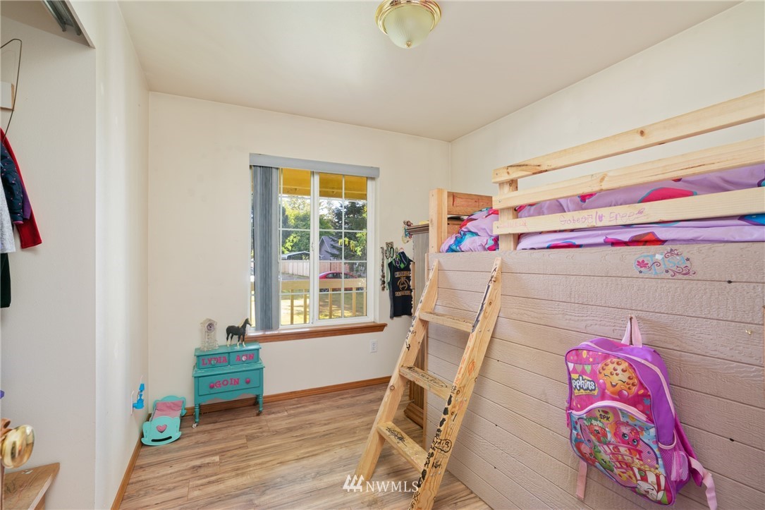 18933 Nutmeg Street Southwest Rochester, WA 98579 - Photo 14 of 18 a bedroom with a bed and a window