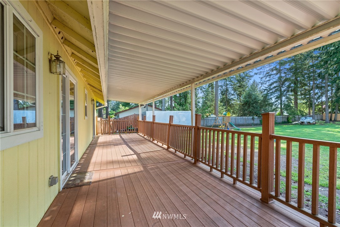 18933 Nutmeg Street Southwest Rochester, WA 98579 - Photo 17 of 18 a view of balcony with wooden floor