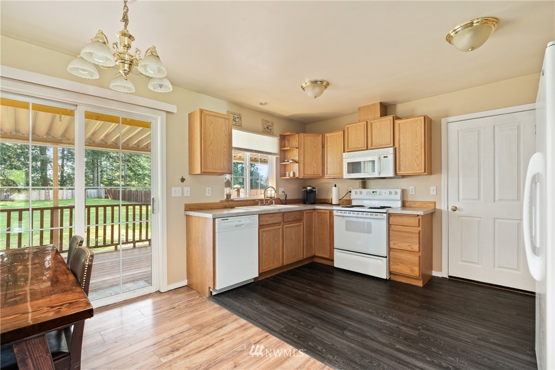 18933 Nutmeg Street Southwest Rochester, WA 98579 - Photo 7 of 18 a kitchen with a refrigerator window and a sink