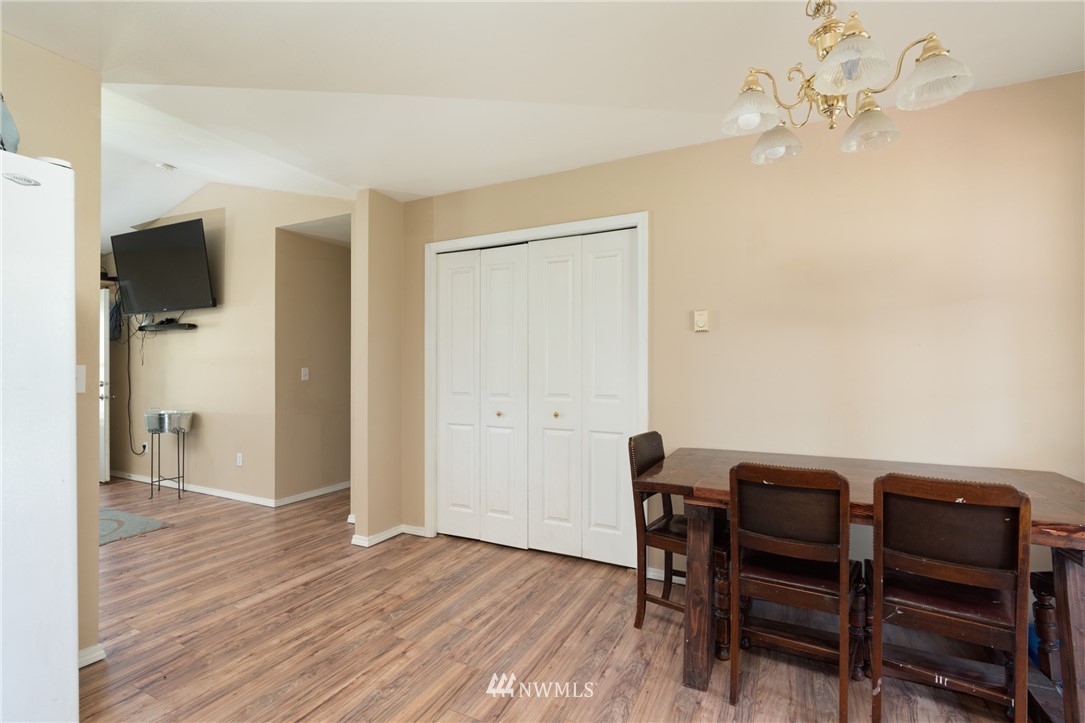 18933 Nutmeg Street Southwest Rochester, WA 98579 - Photo 8 of 18 a view of a dining room with furniture and wooden floor