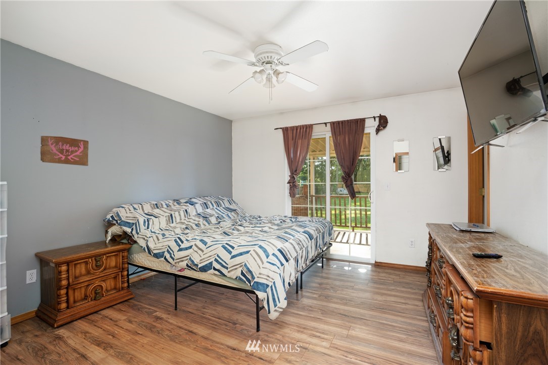 18933 Nutmeg Street Southwest Rochester, WA 98579 - Photo 10 of 18 a bed sitting in a bedroom next to a window