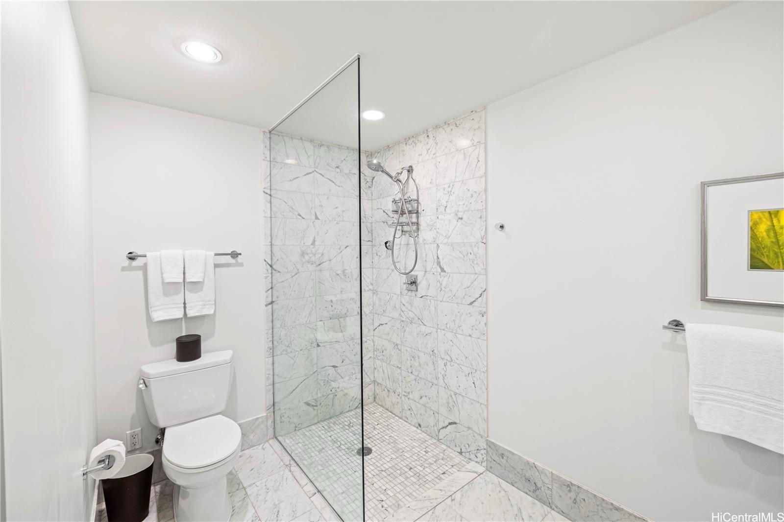 223 Saratoga Road, Unit 3203 Honolulu, HI 96815 - Photo 17 of 24 a bathroom with a toilet and a shower