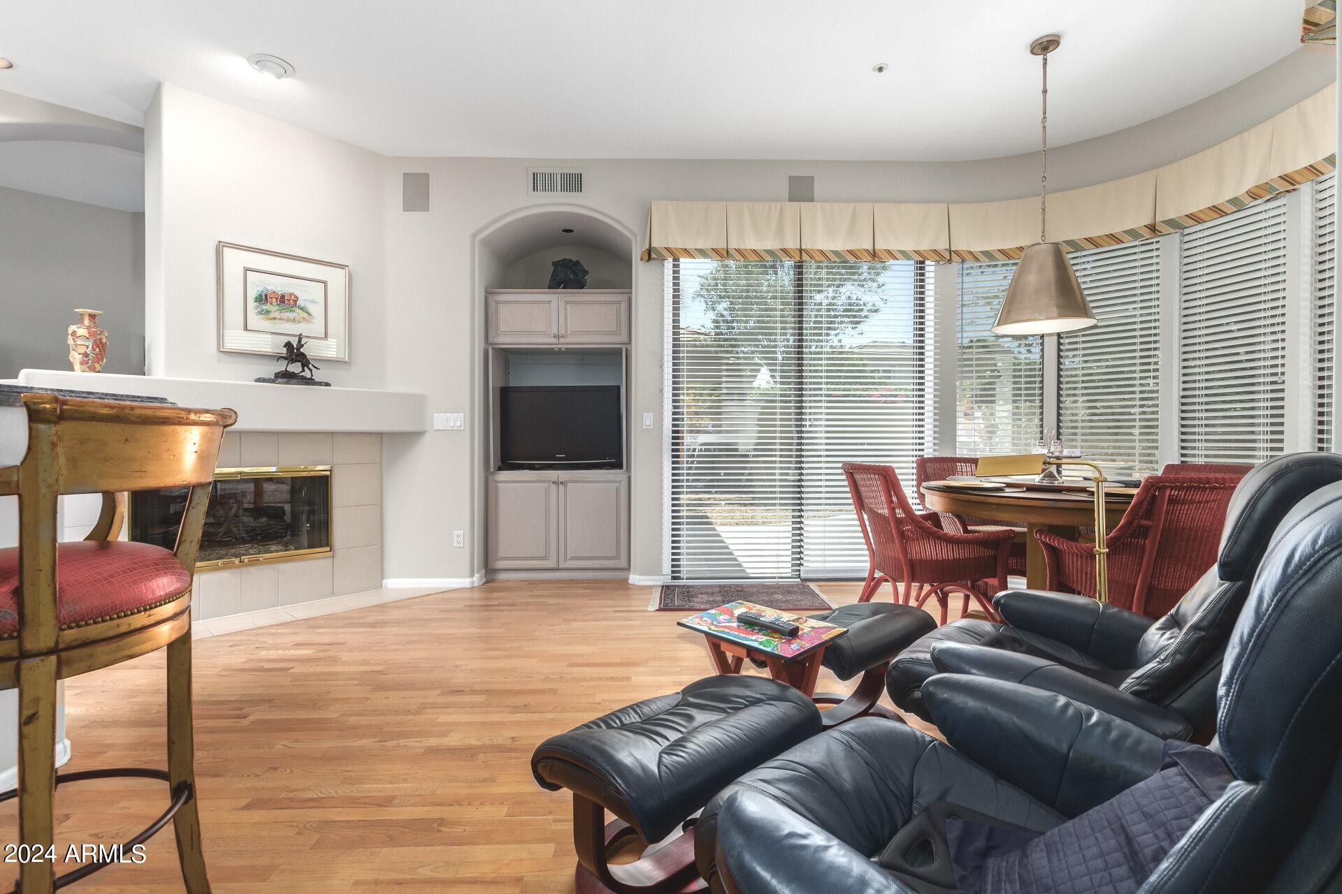 7705 East Doubletree Ranch Road, Unit 28 Scottsdale, AZ 85258 - Photo 16 of 49 Family Room with 2-Way Fireplace
