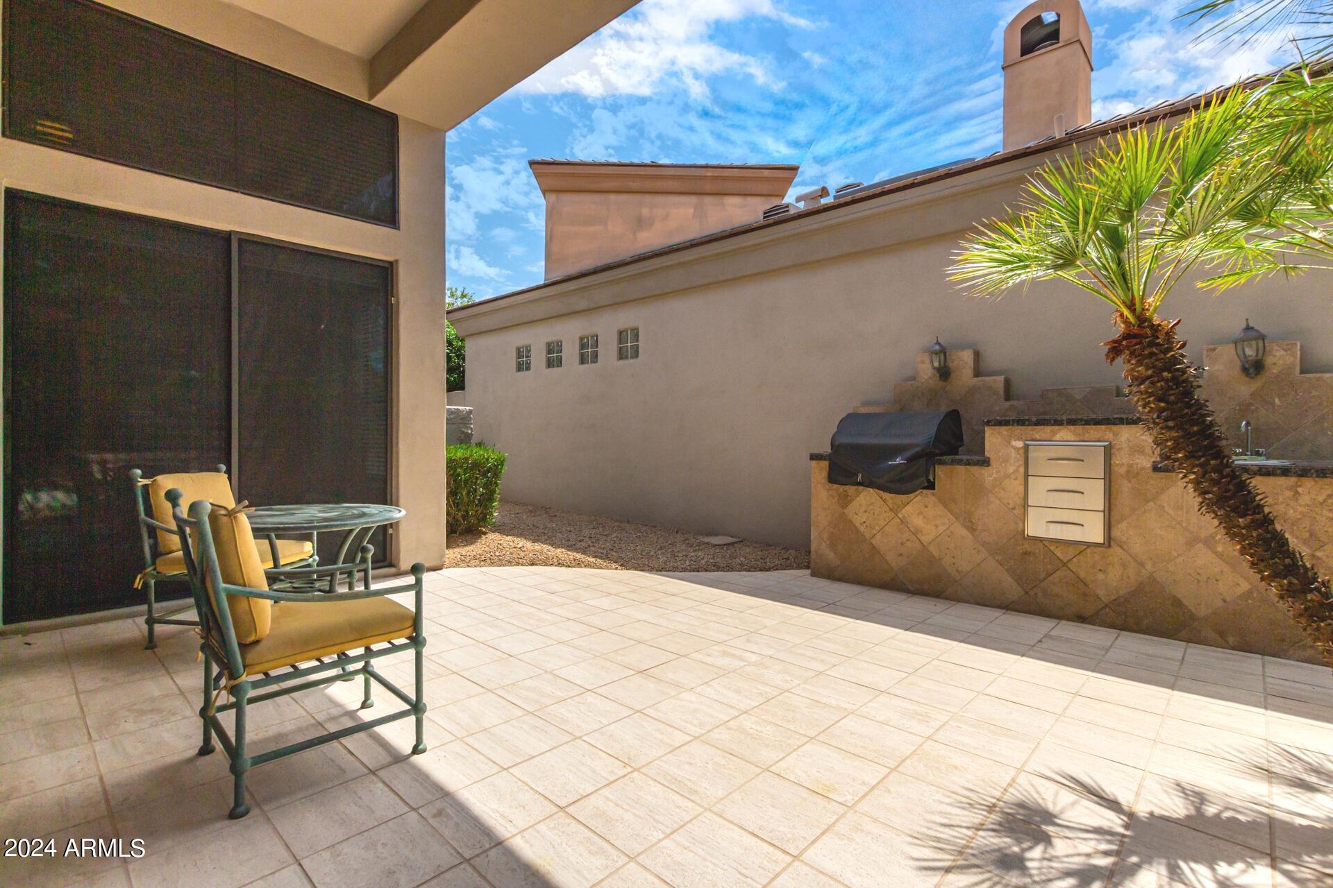7705 East Doubletree Ranch Road, Unit 28 Scottsdale, AZ 85258 - Photo 33 of 49 Backyard with Large Covered Patio