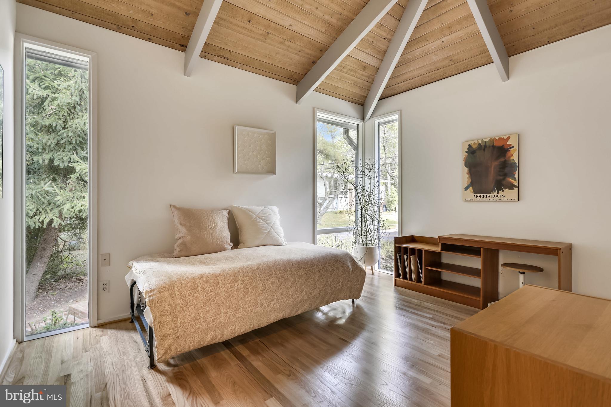 3928 Rickover Road Silver Spring, MD 20902 - Photo 29 of 62 a bedroom with a bed and a dresser next to a window