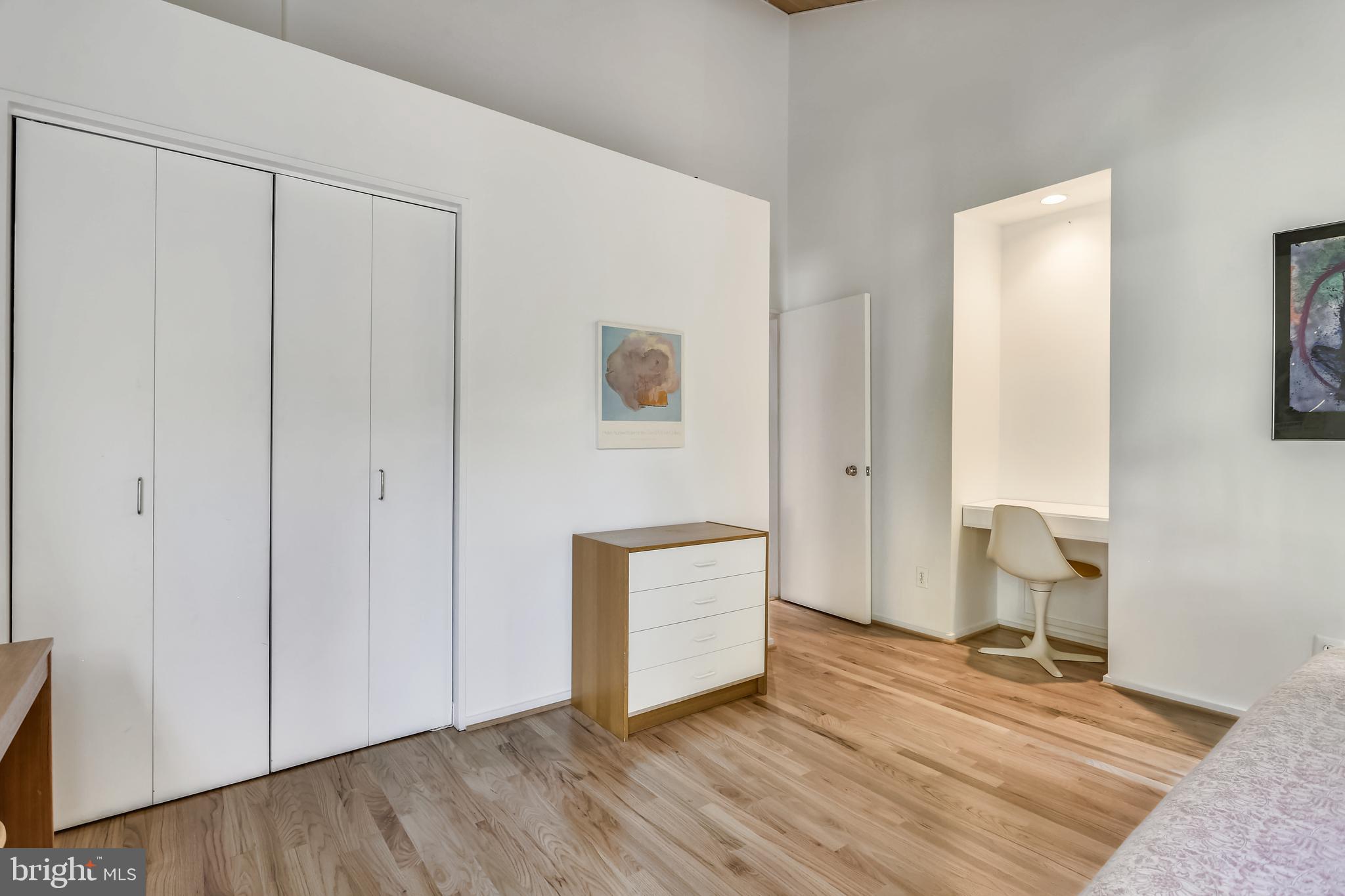 3928 Rickover Road Silver Spring, MD 20902 - Photo 30 of 62 a view of an empty room and bathroom with wooden floor