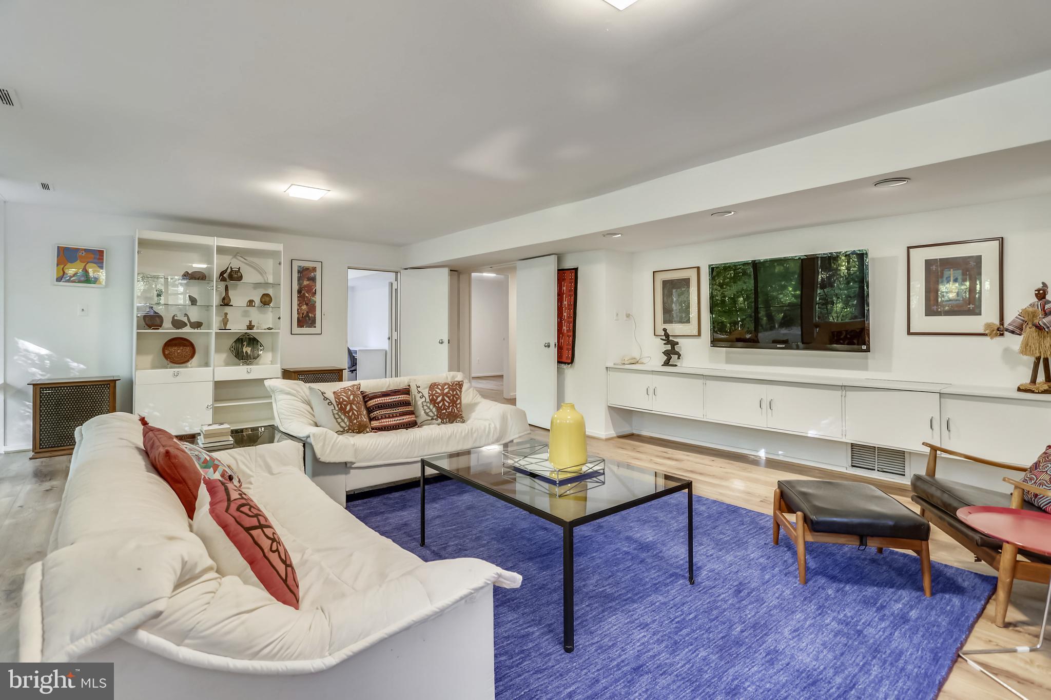 3928 Rickover Road Silver Spring, MD 20902 - Photo 35 of 62 a living room with furniture and a wooden floor