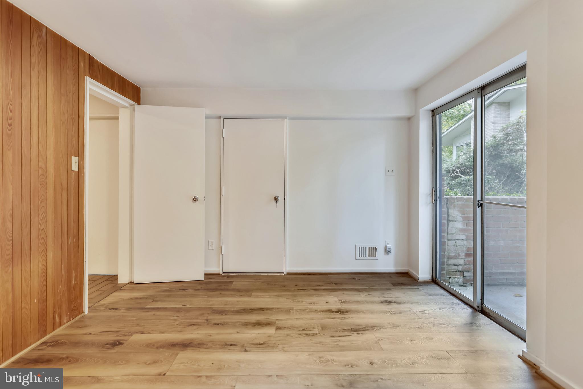 3928 Rickover Road Silver Spring, MD 20902 - Photo 39 of 62 a view of empty room with wooden floor and fan