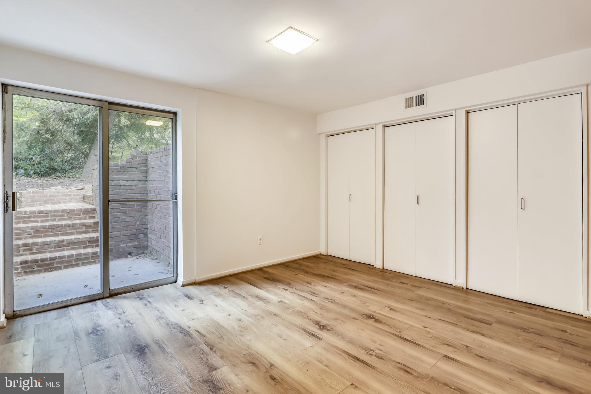 3928 Rickover Road Silver Spring, MD 20902 - Photo 40 of 62 wooden floor in an empty room with a window