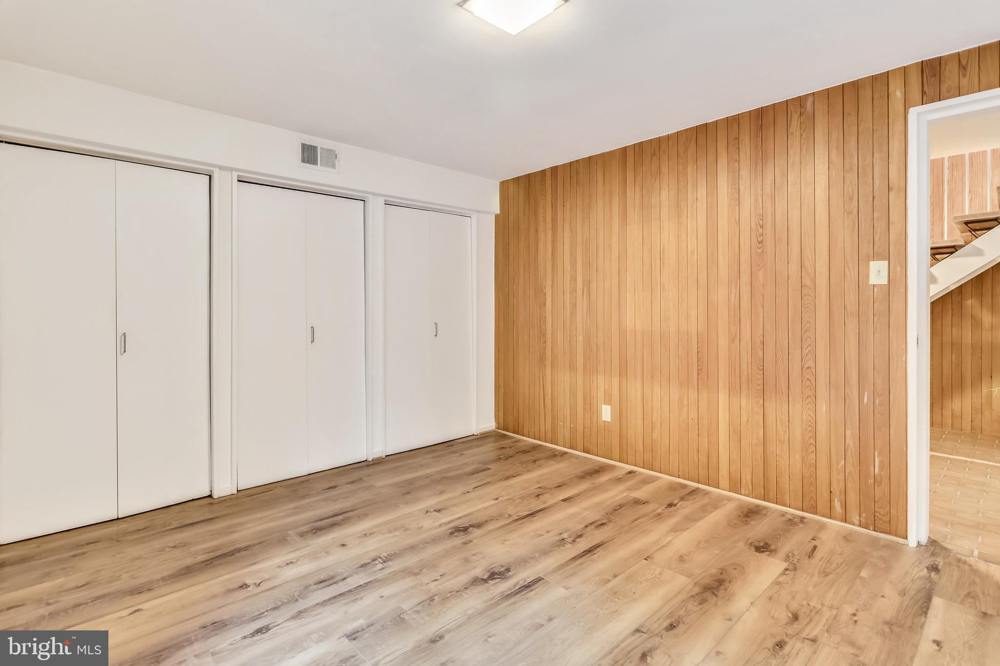 3928 Rickover Road Silver Spring, MD 20902 - Photo 41 of 62 a view of an empty room with wooden floor