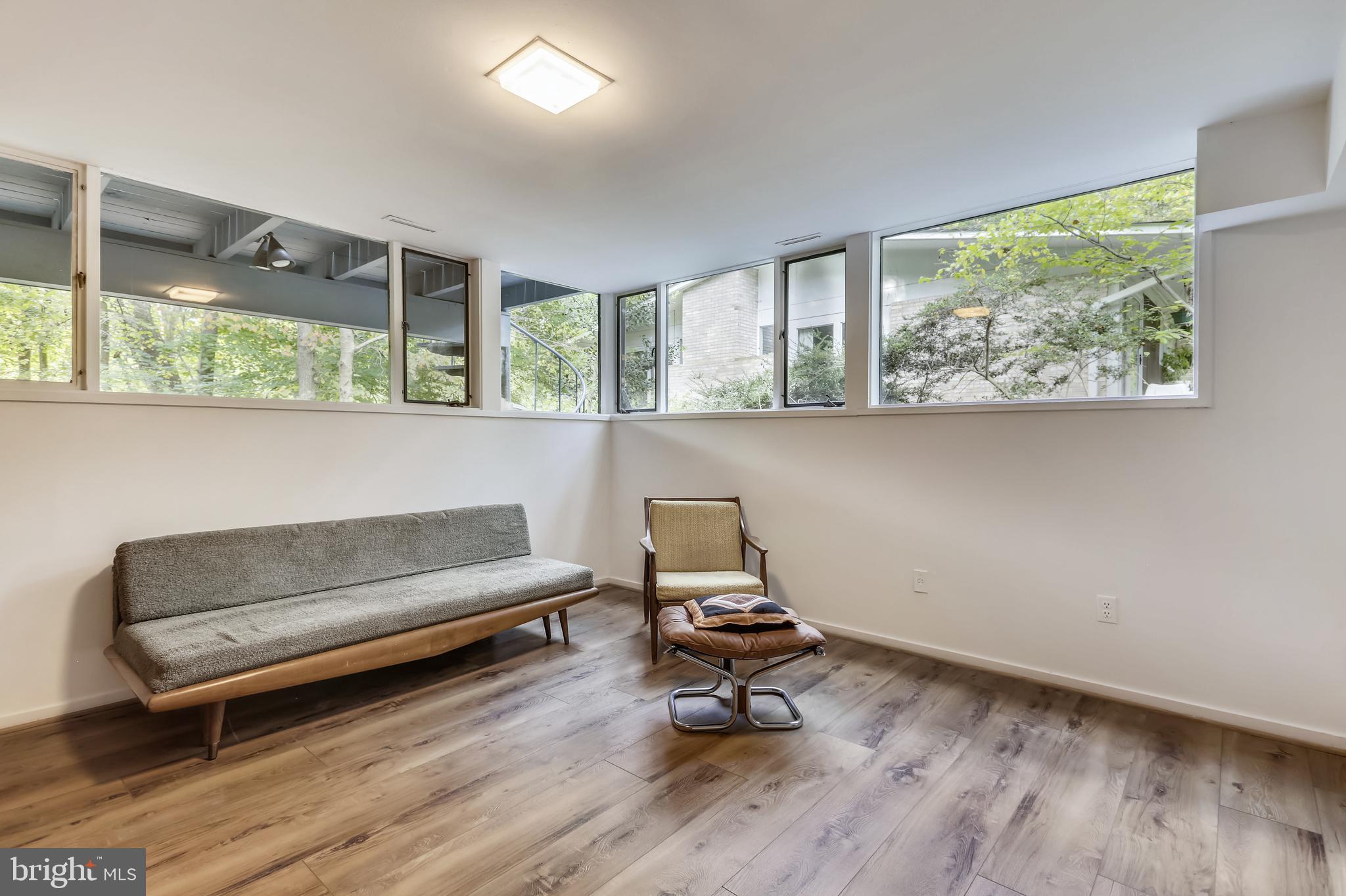 3928 Rickover Road Silver Spring, MD 20902 - Photo 44 of 62 a living room with a couch and a window