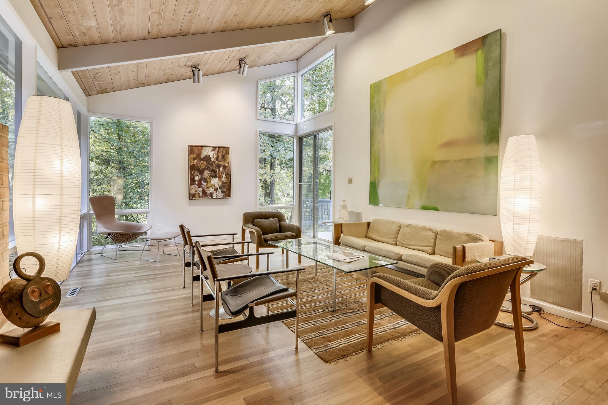 3928 Rickover Road Silver Spring, MD 20902 - Photo 9 of 62 a living room with furniture a flat screen tv and a large window