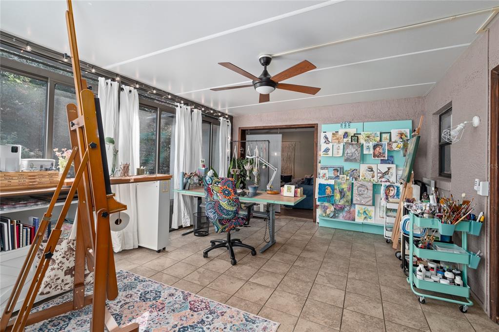 22 Rosedown Boulevard DeBary, FL 32713 - Photo 11 of 31 a living room with furniture and a book shelf
