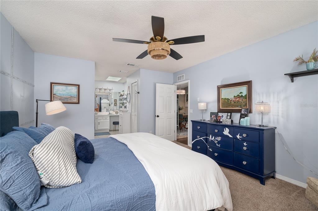 22 Rosedown Boulevard DeBary, FL 32713 - Photo 15 of 31 a bedroom with a bed and wooden floor