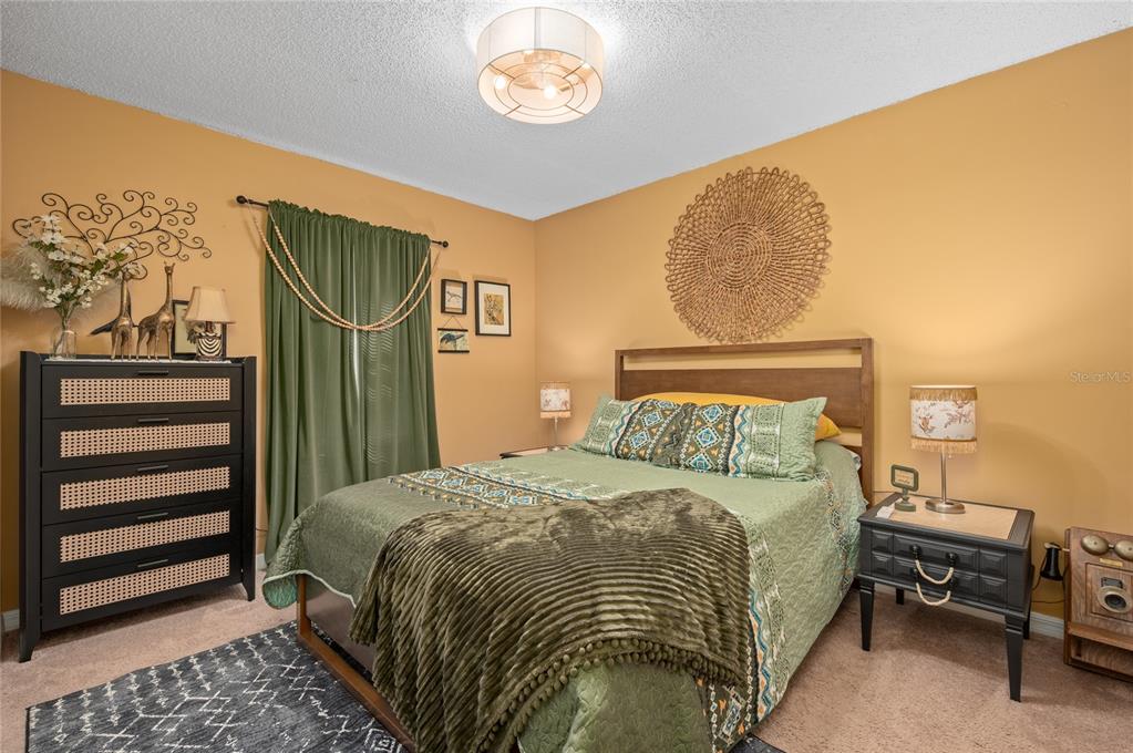 22 Rosedown Boulevard DeBary, FL 32713 - Photo 16 of 31 a bedroom with a bed and a window