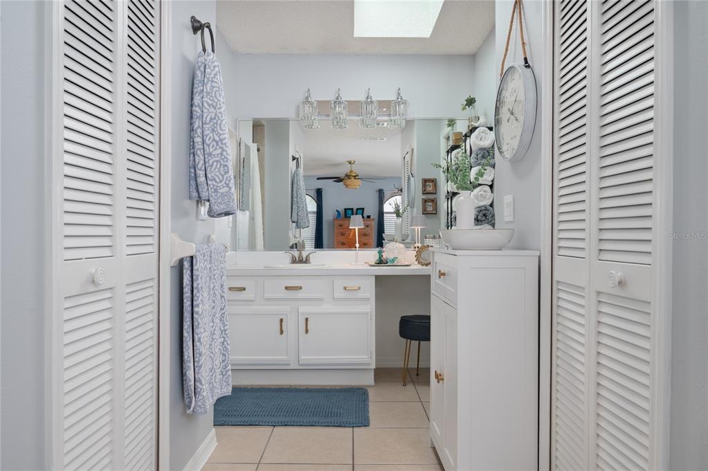 22 Rosedown Boulevard DeBary, FL 32713 - Photo 21 of 31 a bathroom with a sink and mirror