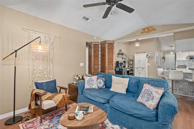 a kitchen with stainless steel appliances a refrigerator and microwave