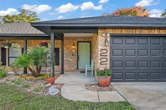 a view of a house with potted plants