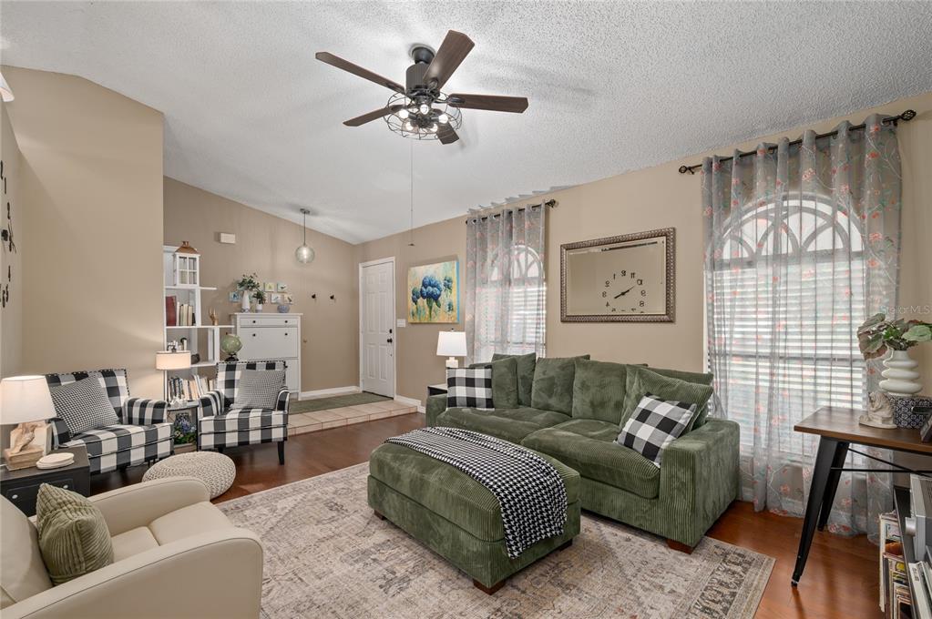 22 Rosedown Boulevard DeBary, FL 32713 - Photo 7 of 31 a living room with furniture and a large window