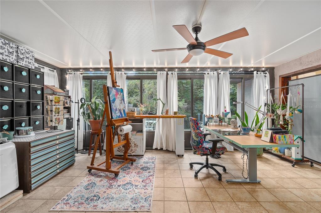 22 Rosedown Boulevard DeBary, FL 32713 - Photo 10 of 31 a view of a livingroom with furniture and floor to ceiling window