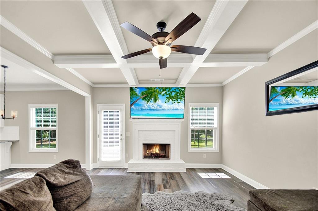 407 Corinth Church Road Winder, GA 30680 - Photo 25 of 66 a living room with furniture and a fireplace