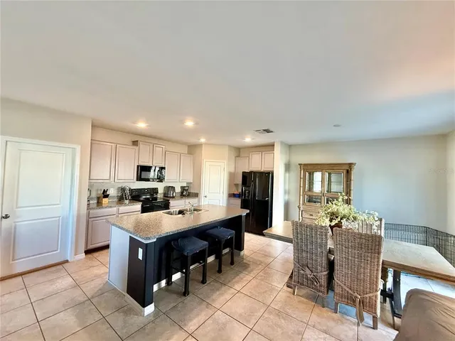 a kitchen with a sink a counter top space and appliances
