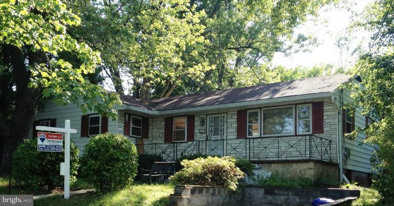 12003 Lafayette Court Silver Spring, MD 20902 - Photo 1 of 22 a front view of a house with garden