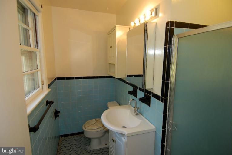 12003 Lafayette Court Silver Spring, MD 20902 - Photo 14 of 22 a bathroom with a sink and toilet