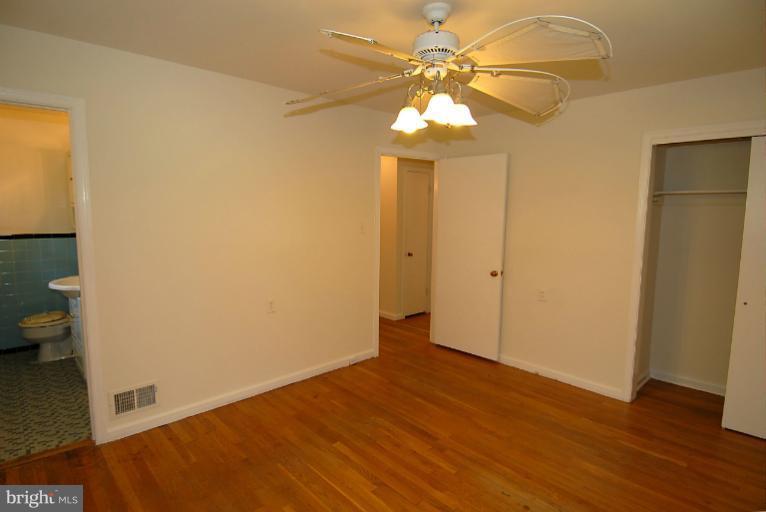 12003 Lafayette Court Silver Spring, MD 20902 - Photo 16 of 22 wooden floor in an empty room