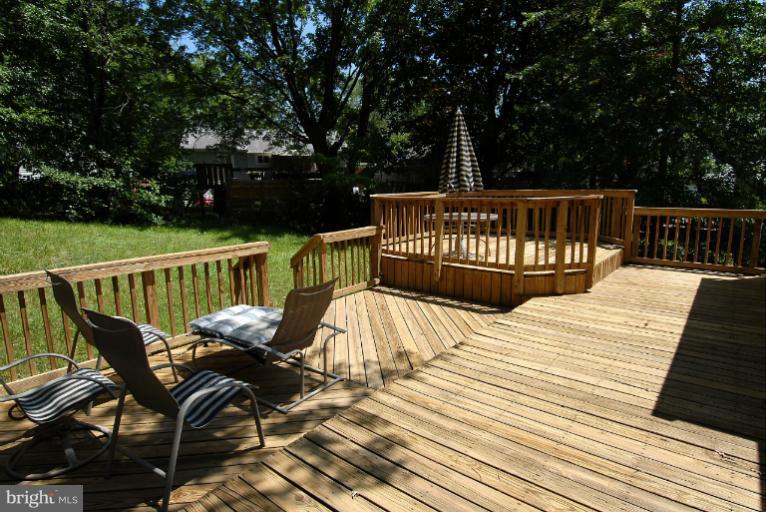 12003 Lafayette Court Silver Spring, MD 20902 - Photo 4 of 22 a view of balcony with wooden floor and outdoor seating