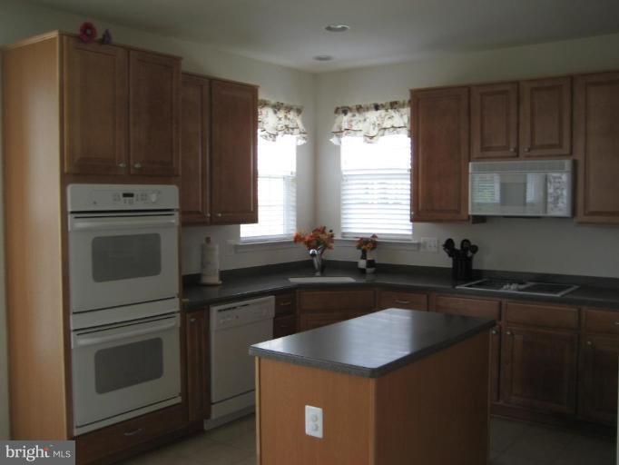 2010 Myrtlewood Road Baltimore, MD 21209 - Photo 3 of 11 a kitchen with granite countertop cabinets stainless steel appliances a sink and window